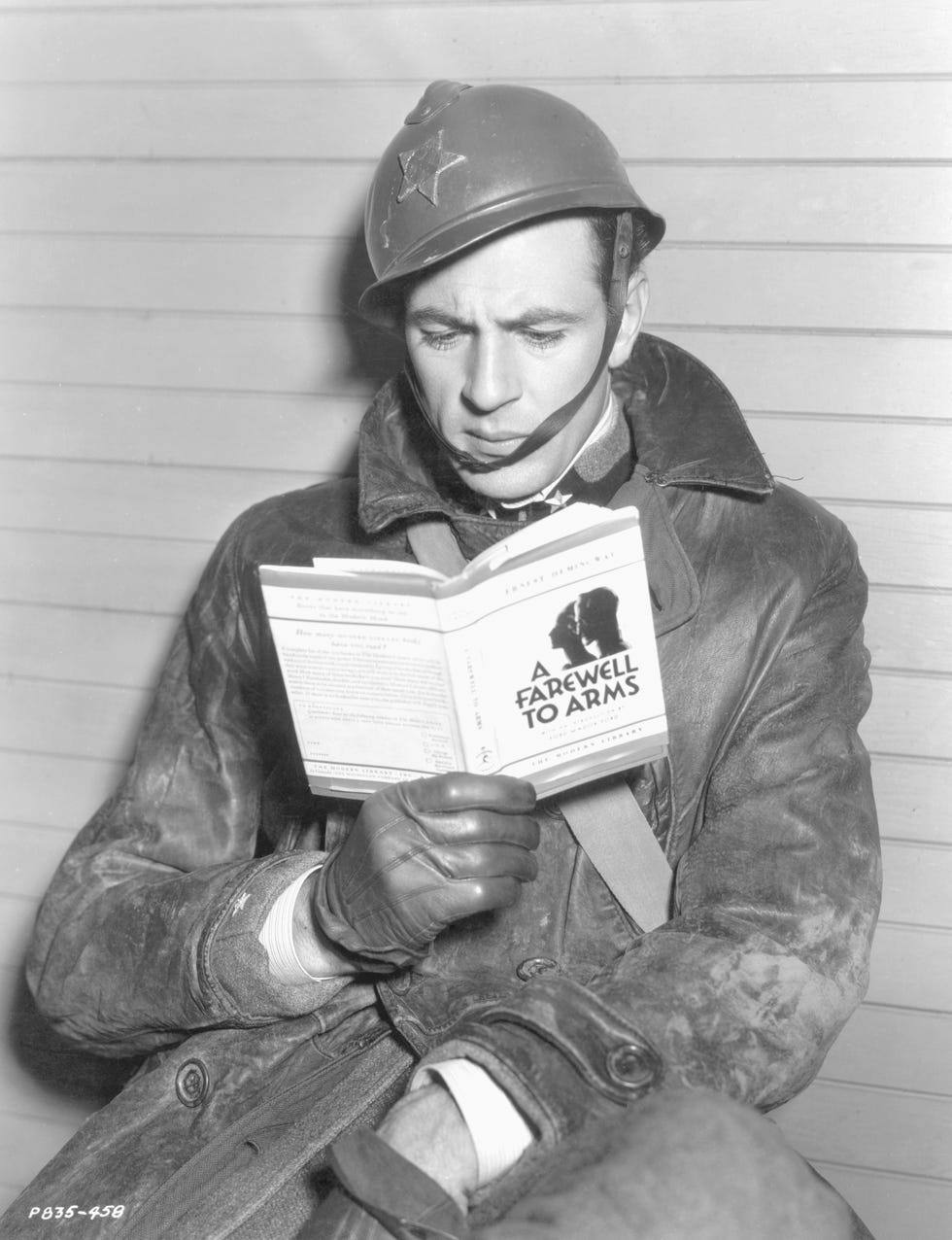 Gary Cooper Reading "A Farewell To Arms" on Set
