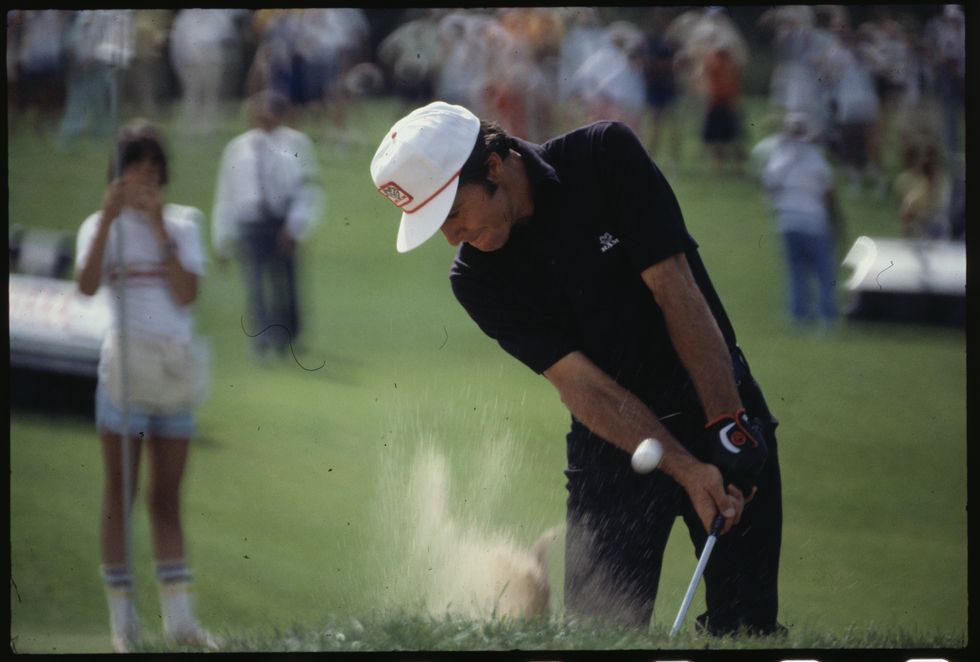 gary player in golfing action