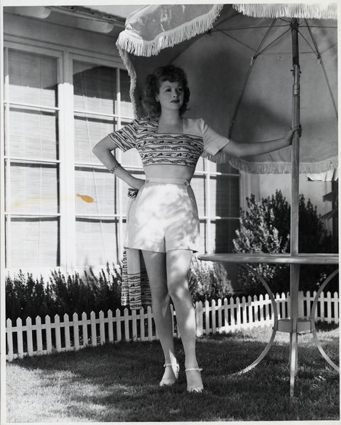 lucille ball poses beside picnic table