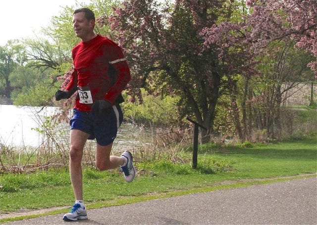 Steve Gathje runs a 5K in 2012n.
