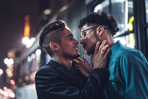 gay boys kissing after work at night