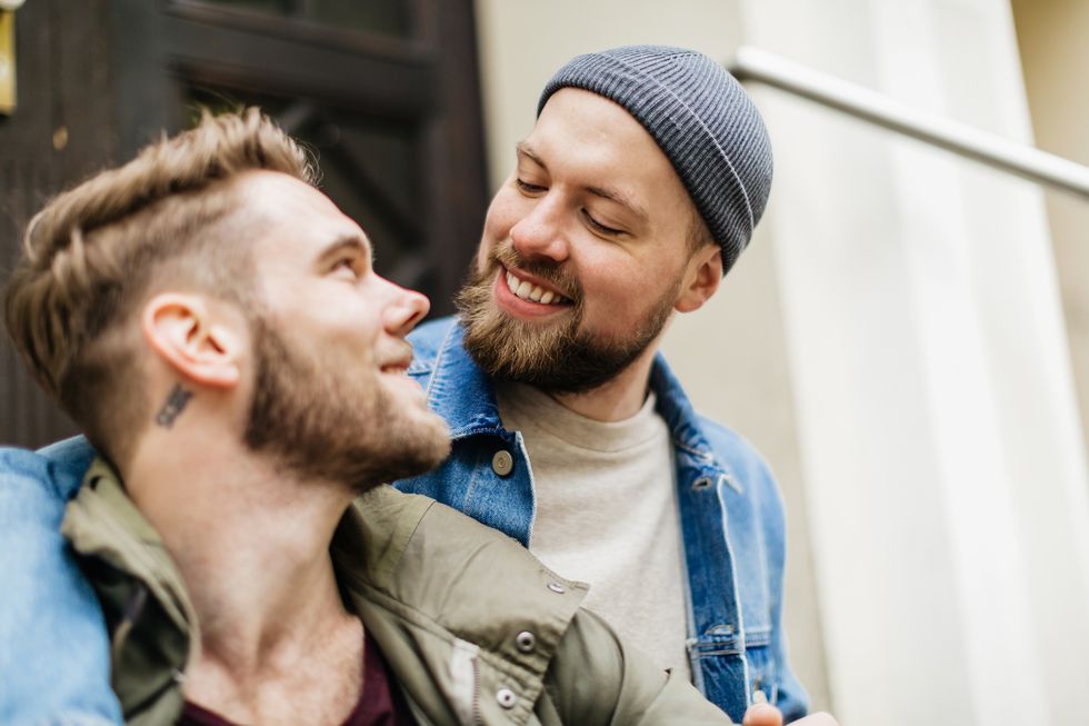 gay couple affectionately looking at one another