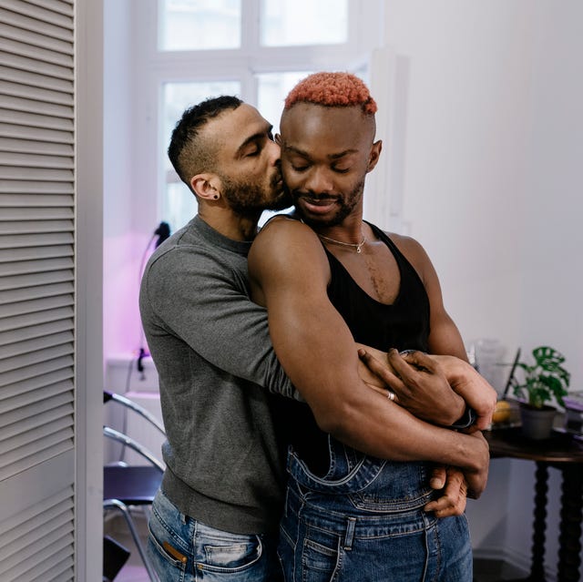 gay couple hugging after meeting on dating app