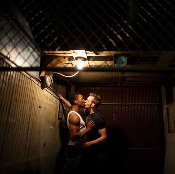 gay men kissing in basement