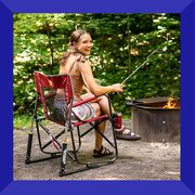 camper in gci outdoor portable rocking chair roasting smore by fire