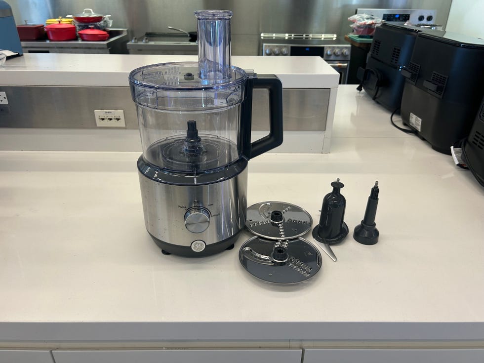 food processor with attachments on a countertop