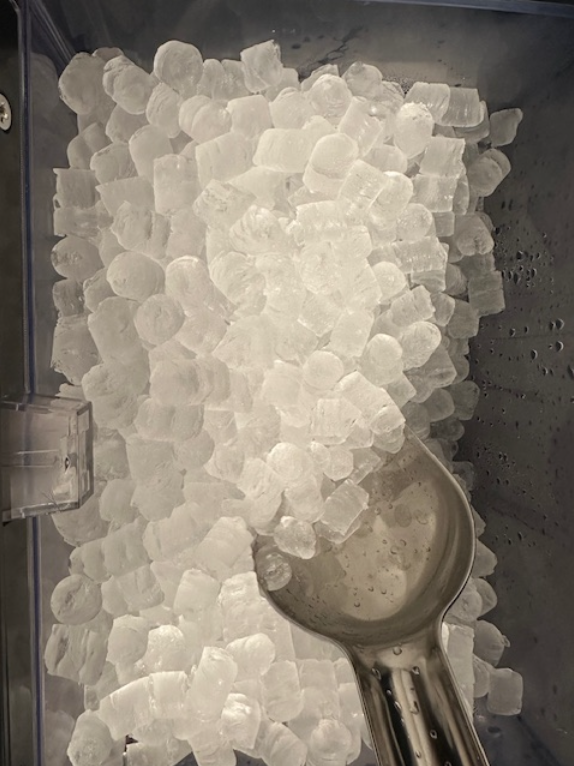 nugget ice in a nugget ice maker drawer with a metal scoop