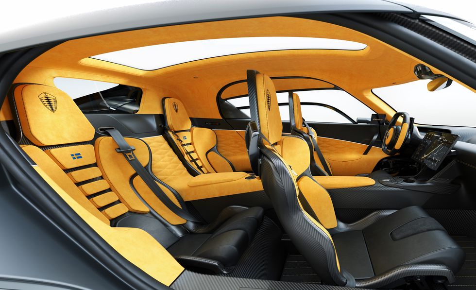 Land vehicle, Vehicle, Car, Automotive design, Yellow, Concept car, Car seat cover, Car seat, Supercar, Steering wheel, 