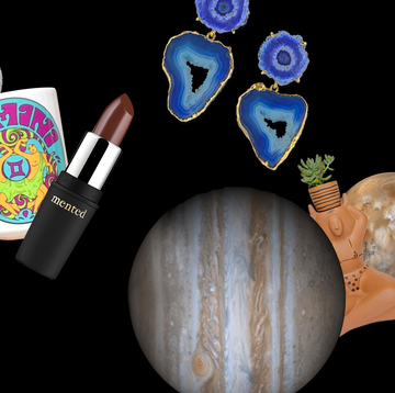 gifts including a pair of earrings, a lipstick, a coffee mug, and a candle are scattered across a night sky between planets