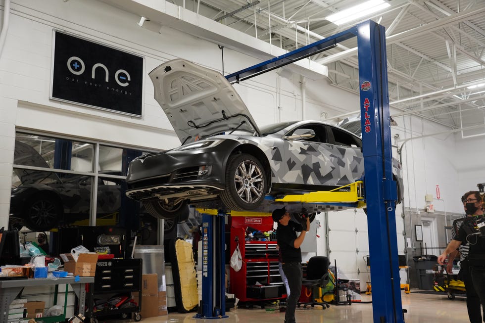 tesla model s with one project gemini ev battery on a lift