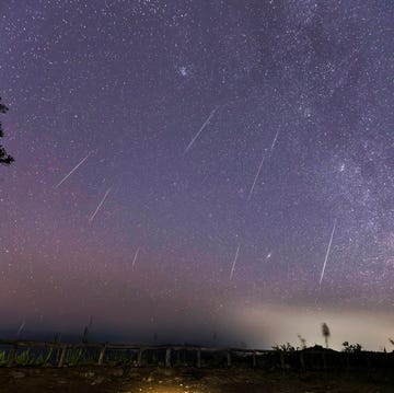 Geminid Meteor Shower and the Milky Way Over a mountain. Geminid Meteor in the night sky