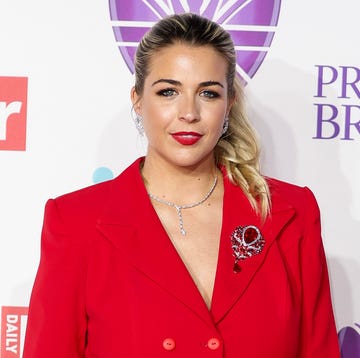 Gemma Atkinson gemma atkinson wearing her hair up in a ponytail and a red suit