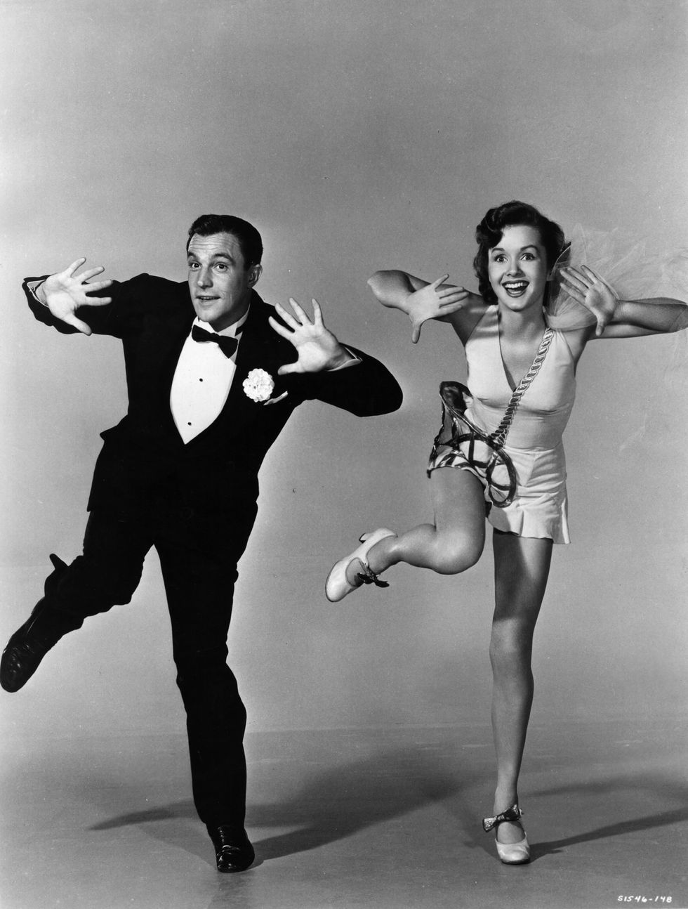 Gene Kelly: Debbie Reynolds was 18 when she starred as Gene Kelly's love interest in Singin' in the Rain. She had never sung or danced before, but she said learned a lot from Kelly whom she has described 'as the most exacting director I ever worked for.' (Photo by Hulton Archive/Getty Images)
