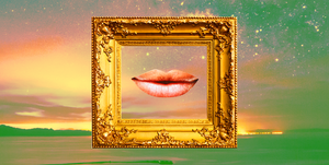 a slightly smiling mouth is framed inside a golden picture frame over a green and pink sky