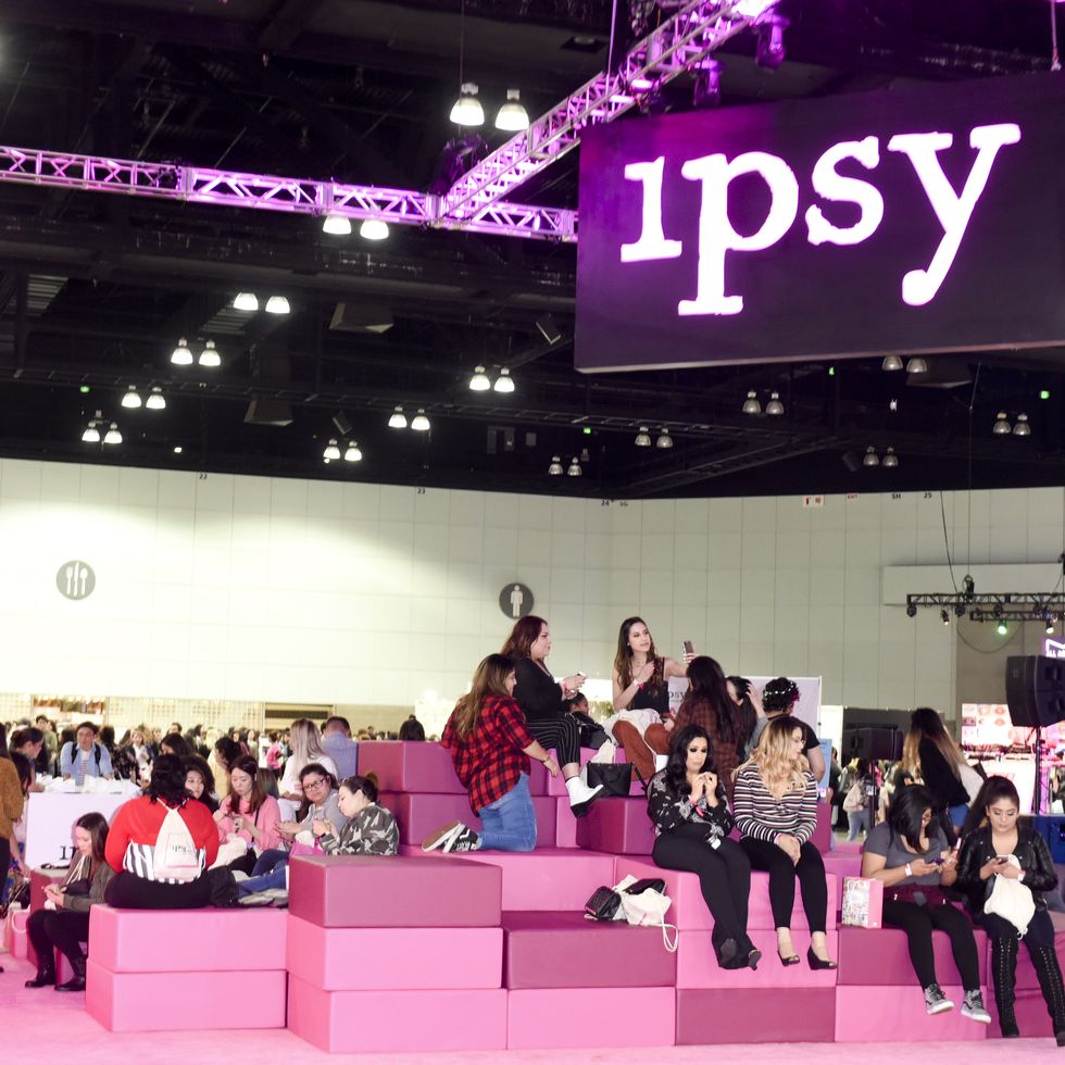 ipsy,  best subscription boxes for teens, women sitting on pink boxes at an ipsy event