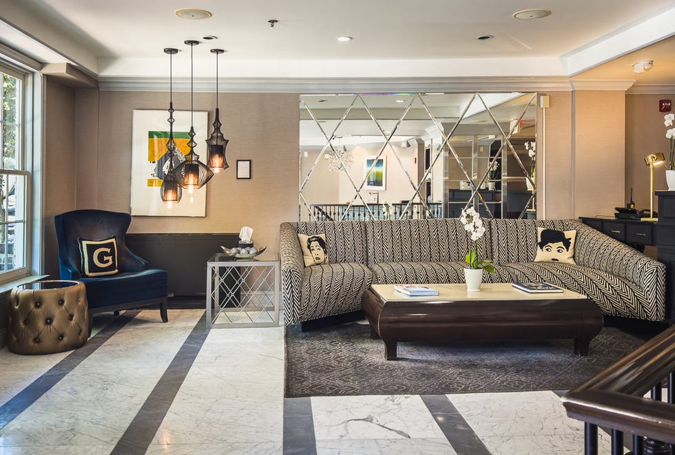 a cozy lounge area featuring modern furnishings and decor