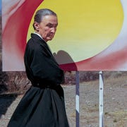 Georgia O'Keeffe poses outdoors beside an easel with a canvas from her series, 'Pelvis Series Red With Yellow,' in Albuquerque, New Mexico, 1960 georgia o'keeffe poses outdoors beside an easel with a canvas from her series, 'pelvis series red with yellow,' in albuquerque, new mexico, 1960