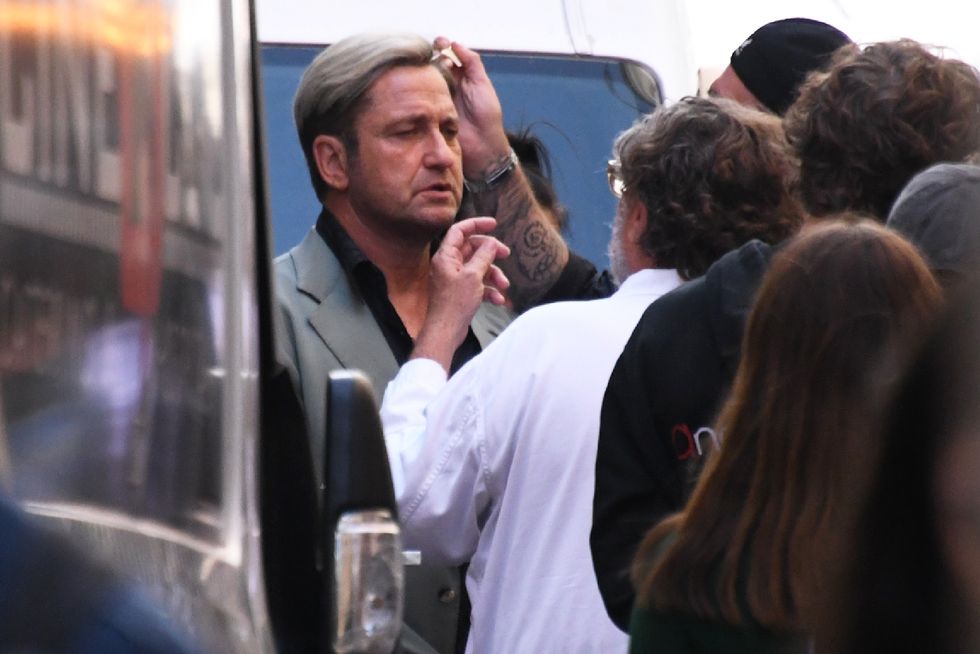 gerard butler with blond hair while filming in the hand of dante