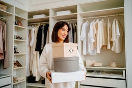 a woman decluttering her wardrobe