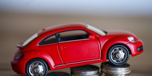 Volkswagen Beetle on coin stacks