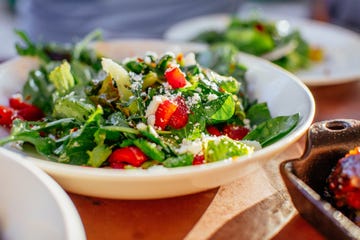 spinach salad with strawberries, goat cheese, balsamic, and walnuts