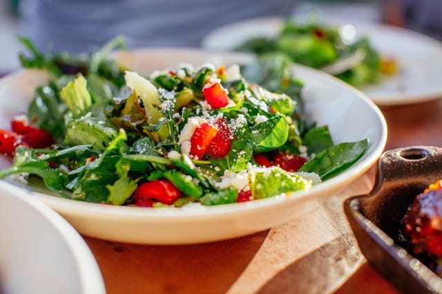 spinach salad with strawberries, goat cheese, balsamic, and walnuts