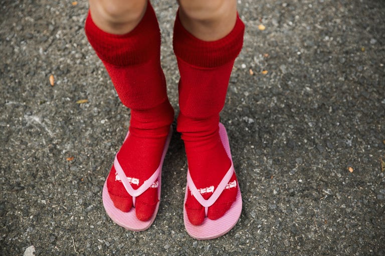 a person wearing red and white socks