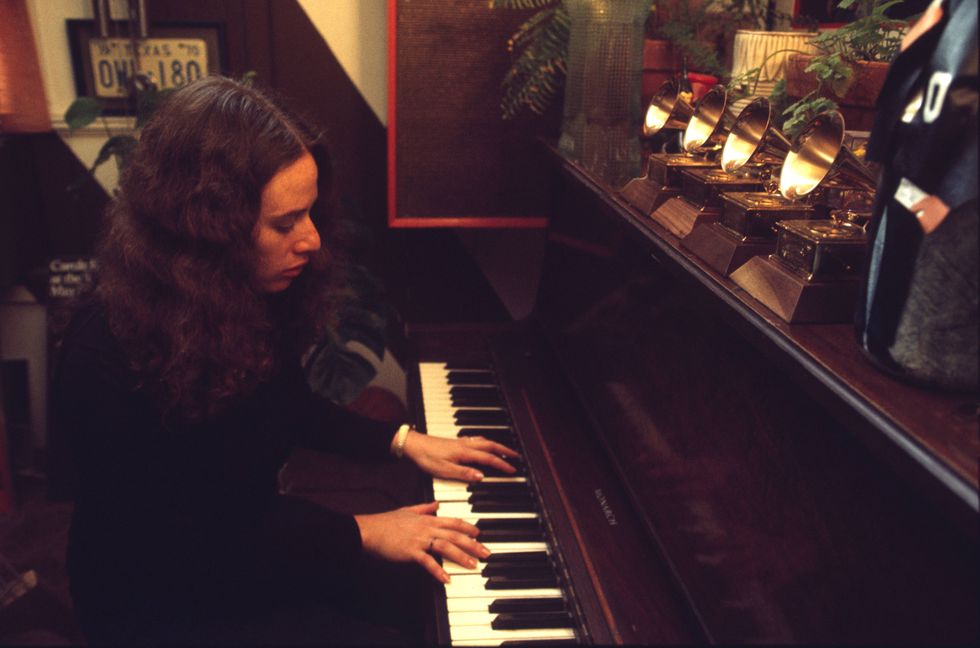 Carole King playing the piano in record producer Lou Adler's office  in Los Angeles, California in March 1971