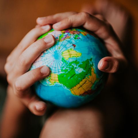 Child holding a globe