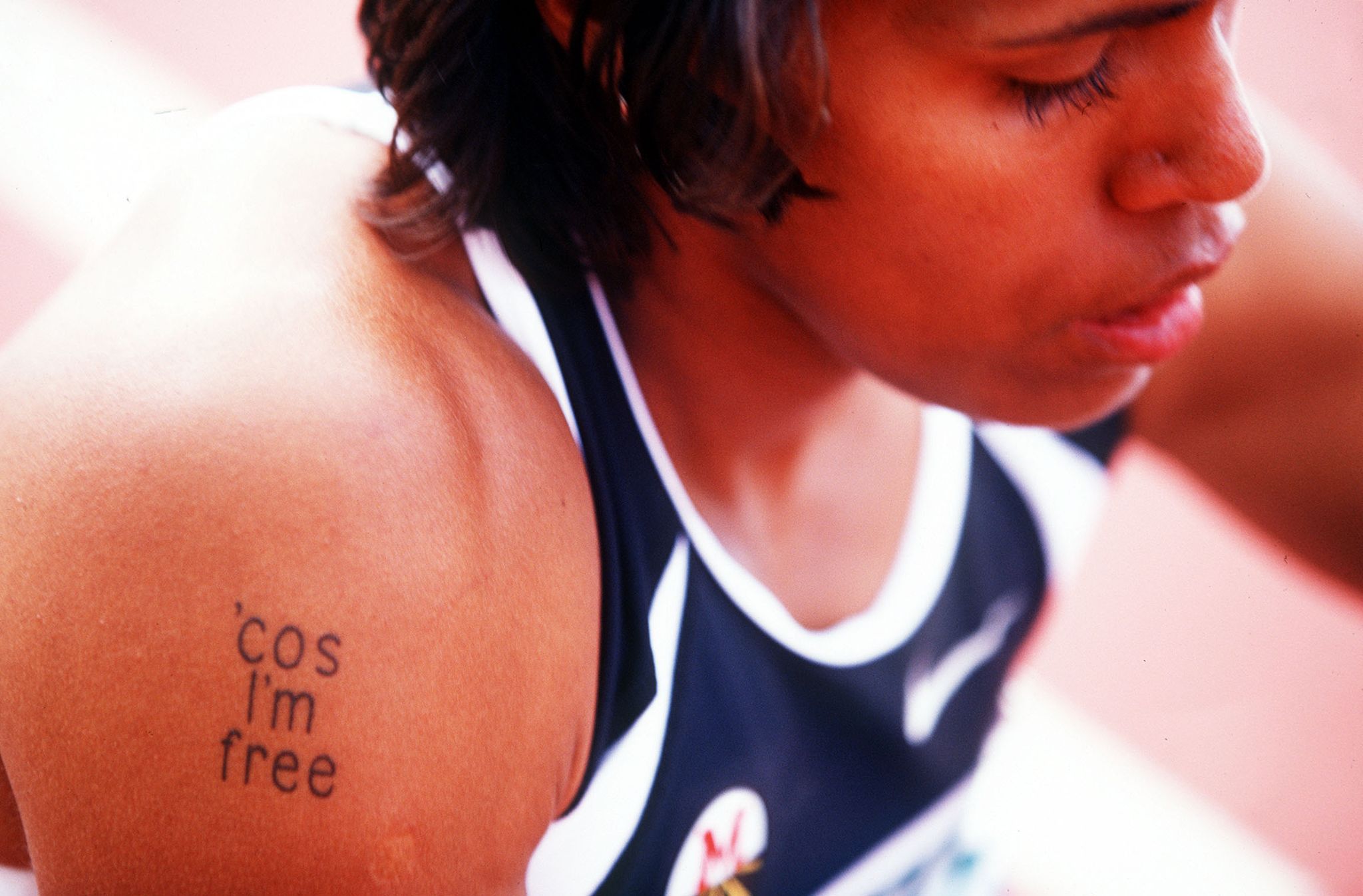 15 jan 2000  cathy freeman of australia shows off her tattoo during the optus grand prix at the ais athletics track,canberra australia mandatory credit scott barbourallsport
