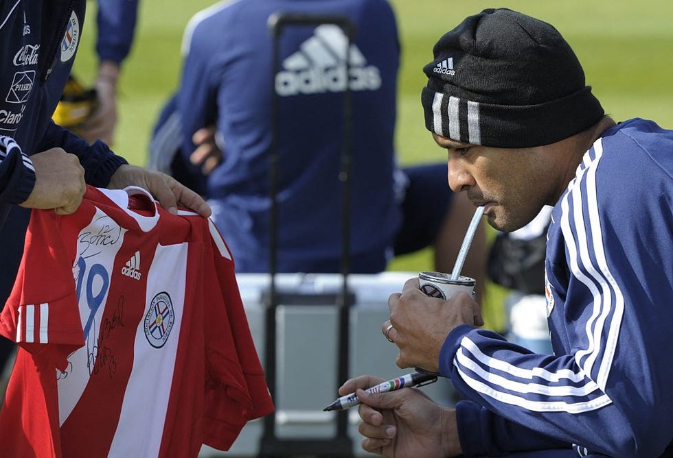 paraguays defender paulo da silva drinks terere (typical paraguayan yerba mate tea prepared with cold water) before a training session at michaelhouse school in balgowan on june 11, 2010 ahead of the 2010 football world cup. afp photo / juan mabromata (photo by juan mabromata / afp) (photo by juan mabromata/afp via getty images)