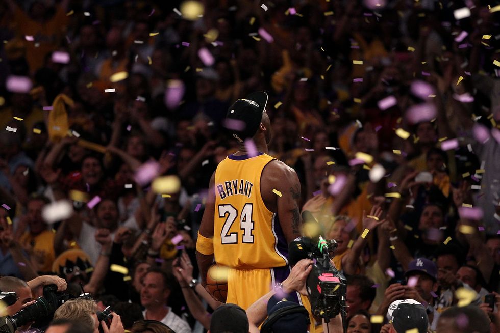 NBA - Kobe Bryant #24 of the Los Angeles Lakers adjusts his jersey