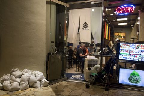 Waikiki businesses take precautions to keep both visitors and property safe as Hurricane Lane approaches.