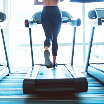 woman running on treadmill