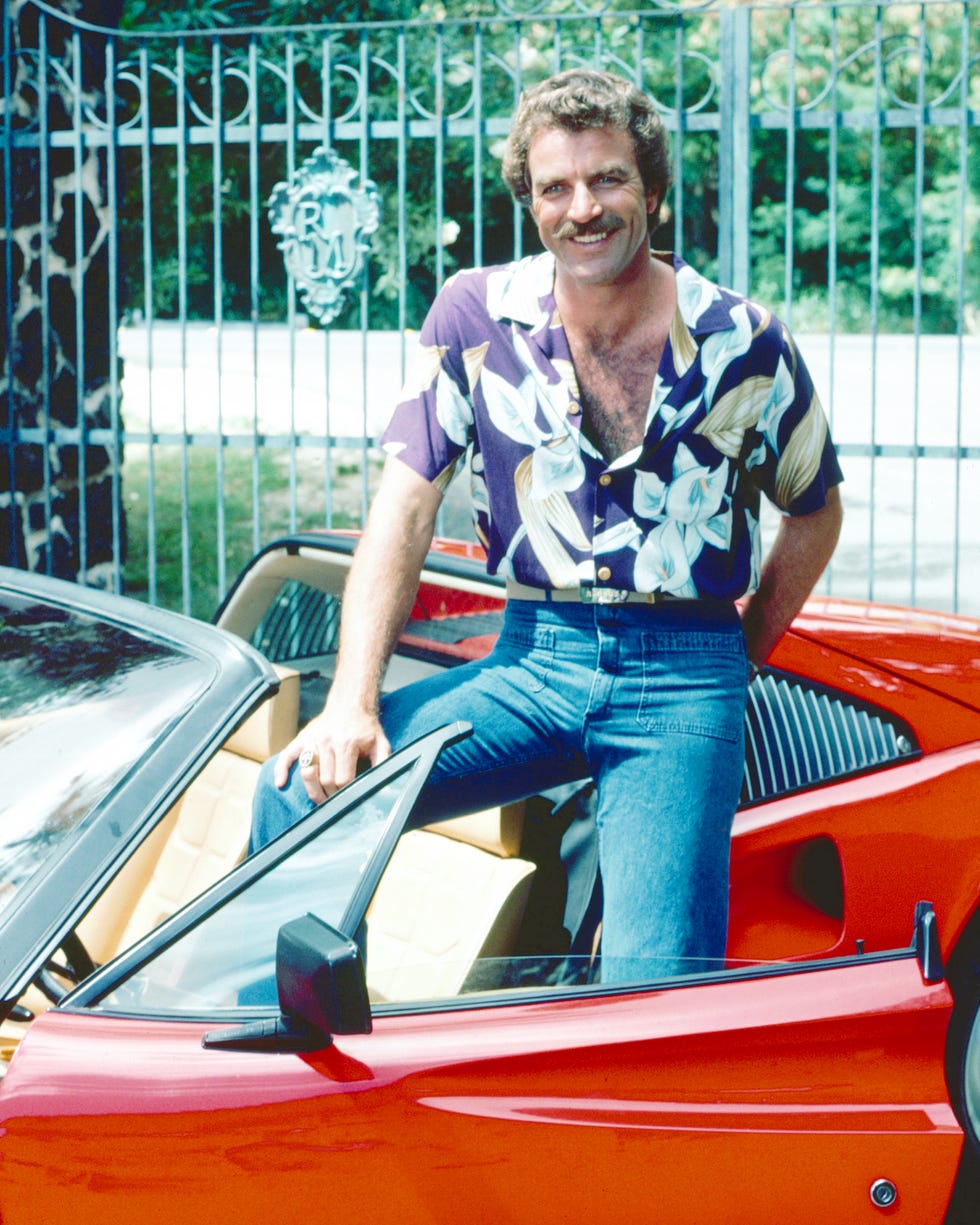 tom selleck as the titular investigator in the television series magnum, pi, circa 1985 he is posing with his red ferrari 308 photo by silver screen collectionarchive photosgetty images