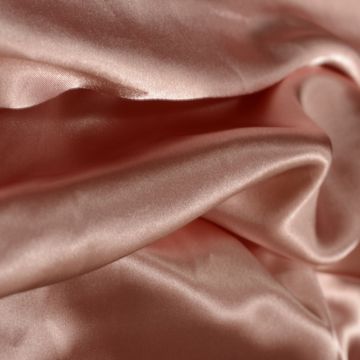 Full Frame Shot Of Peach Sheet On Bed