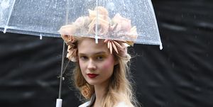 Umbrella, Beauty, Smoking, Lip, Fashion accessory, Blond, Headgear, Photography, Smoke, Rain, 