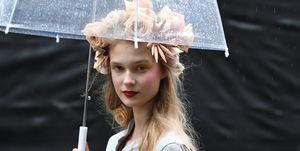 Umbrella, Beauty, Smoking, Lip, Fashion accessory, Blond, Headgear, Photography, Smoke, Rain, 