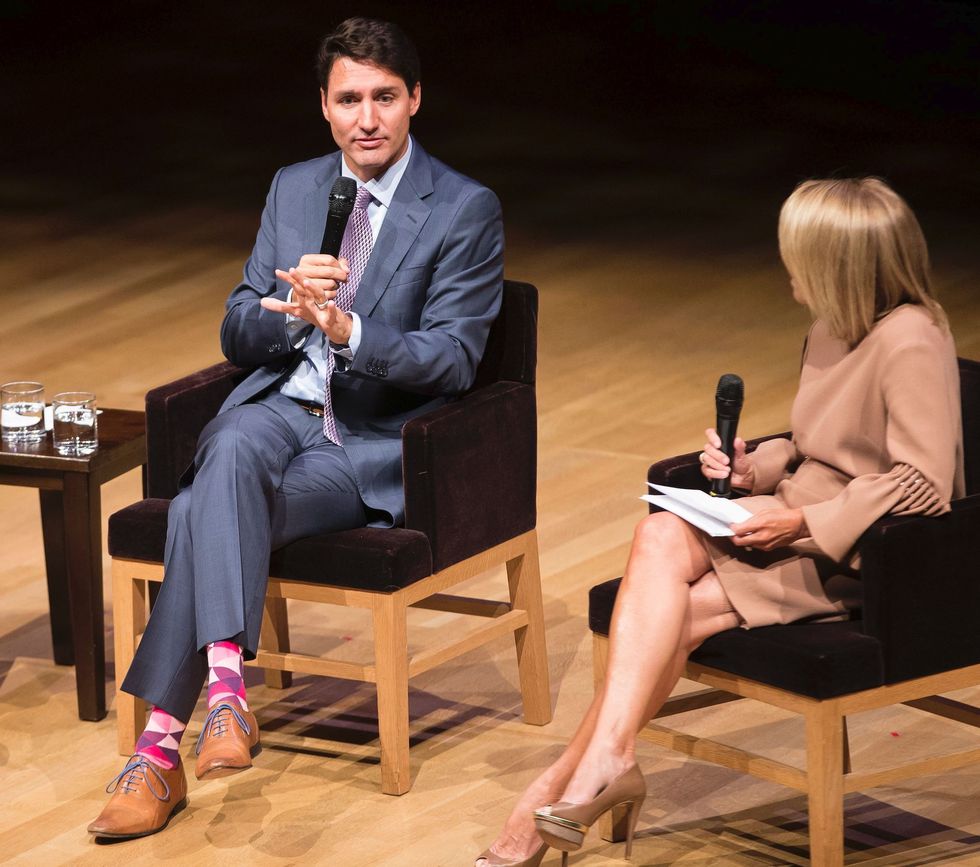 prime minister justin trudeau speaks with moderator katie couric during an armchair discussion with and christine lagarde, managing director of the international monetary fund at the women in the world summit  in toronto, ontario, september 10, 2018 photo by geoff robins  afp        photo credit should read geoff robinsafp via getty images