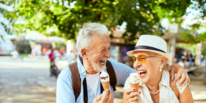 senior couple enjoying ice cream and laughing