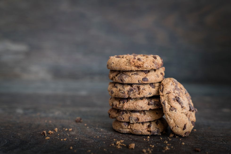 Chocolate cookies on rustic wooden background.