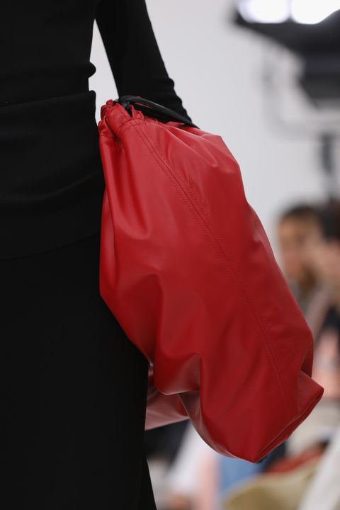 Red, Fashion, Shoulder, Joint, Bag, Haute couture, Leather, Fashion design, Fashion accessory, Glove, 