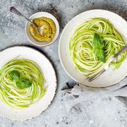 Zucchini spaghetti with basil. Vegetarian vegetable low carb pasta. Zucchini noodles or zoodles.