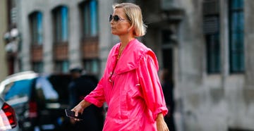 a guest wears sunglasses, a pink dress, black sandals, during london fashion week september 2018 on september 14, 2018 in london, england photo by edward berthelotgetty images