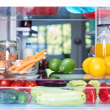 Opened fridge from the inside. opened fridge from the inside full of vegetables, fruits and other groceries