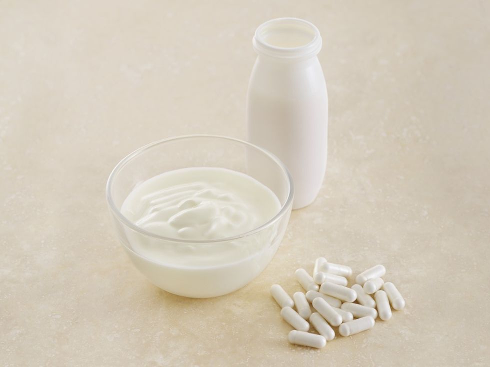 probiotic pills and yoghurt, still life