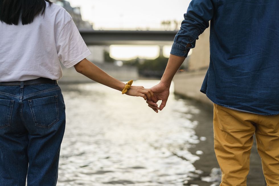 Holding hands at river Seine