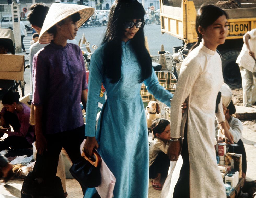 women wearing ao dai, shopping in saigon circa 1970