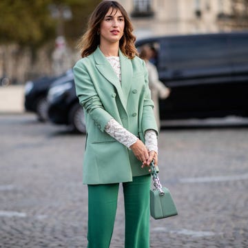 Jeanne Damas wearing green blazer, flared pants is seen outside Valentino during Paris Fashion Week Womenswear Spring/Summer 2019 on September 30, 2018 in Paris