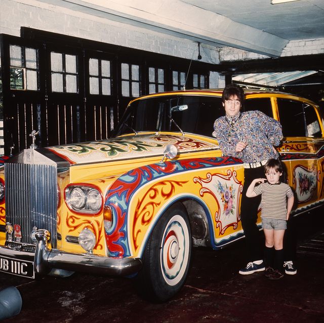 united kingdom   january 01  the british composer and member of the group the beatles posing in his houses garage in liverpool with his son julian lennon in front of his psychedelic rolls royce  photo by keystone francegamma keystone via getty images